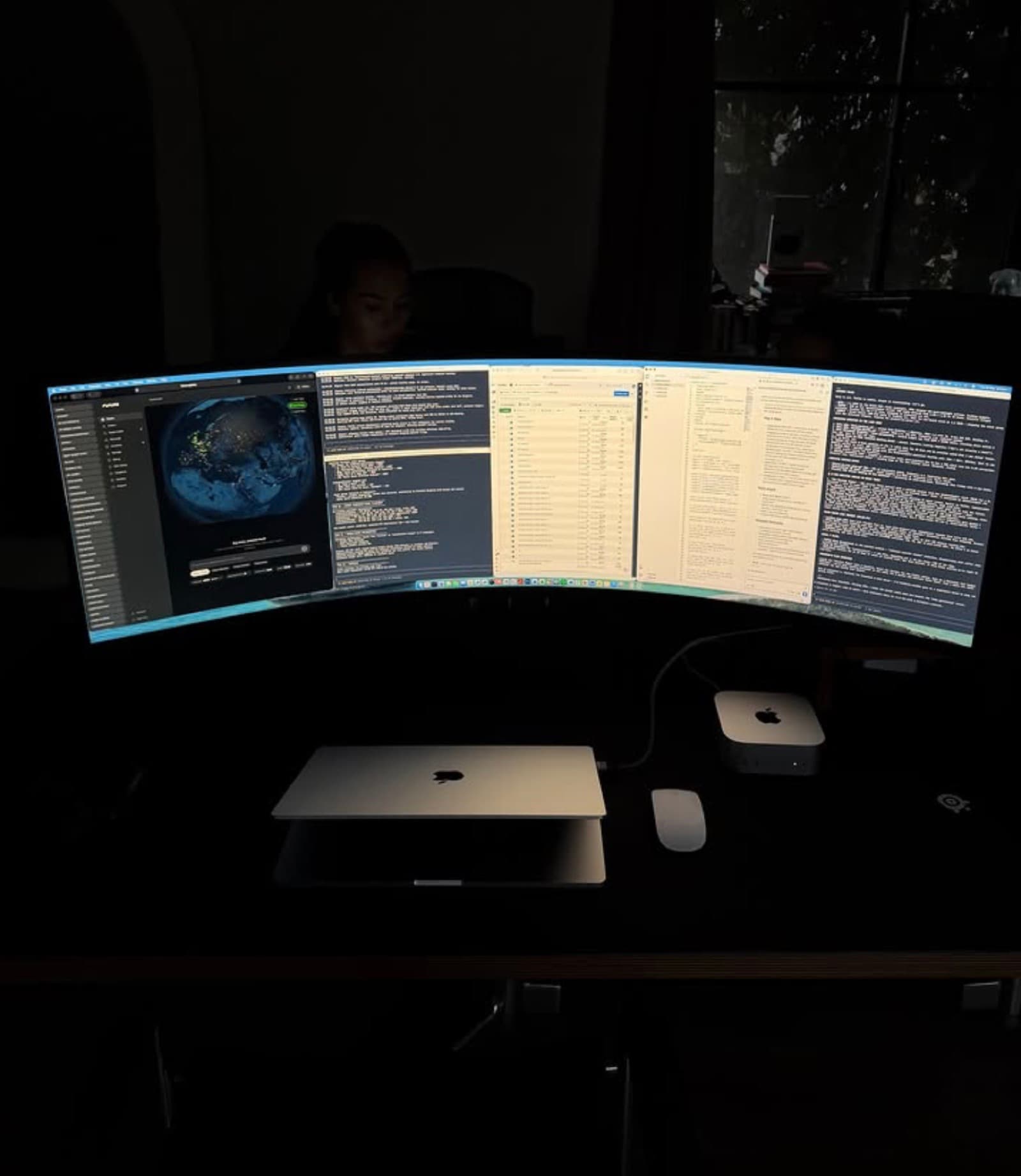 Noah's triple-screen setup at night — AI doing the heavy lifting
